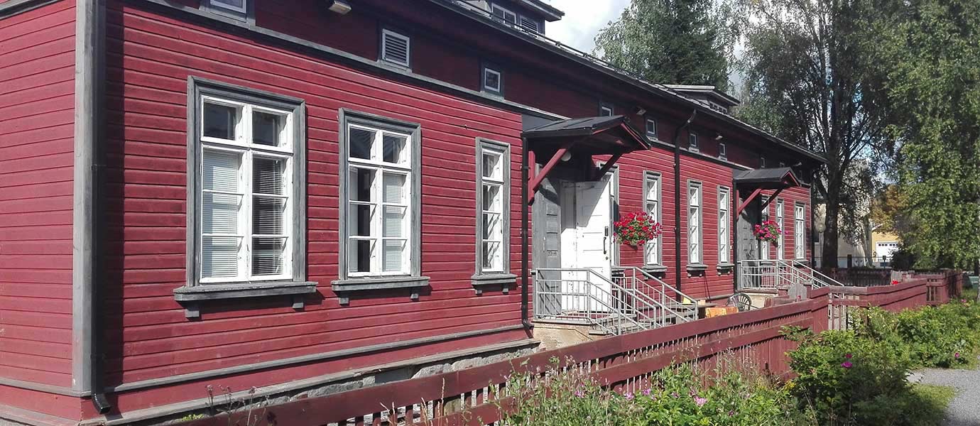 Apartment Hotel Marja is a charming, red wooden building.